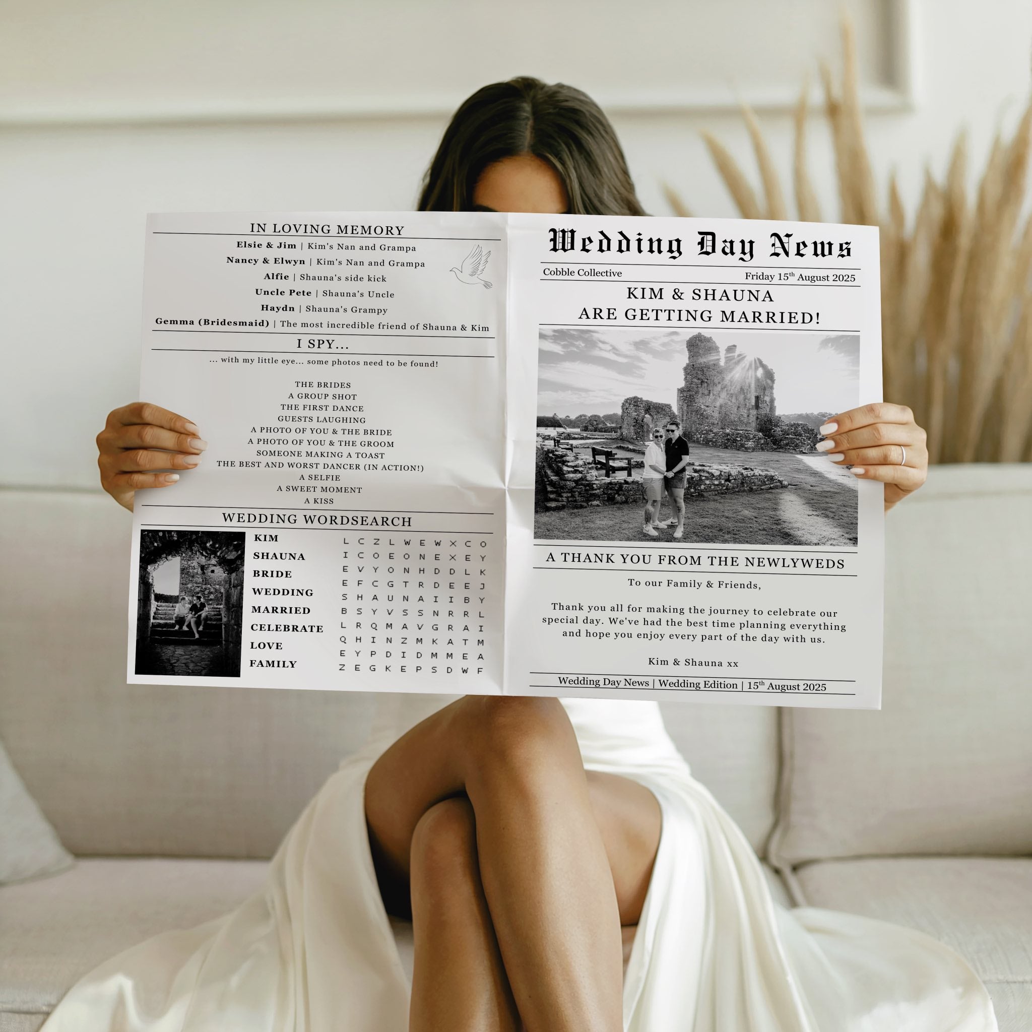 Person holding a wedding-themed newspaper in front of their face, sitting on a couch.